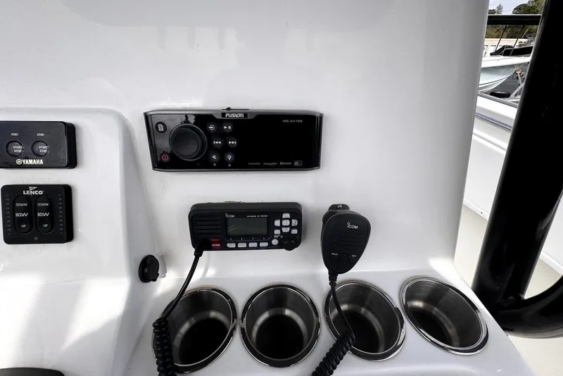 Slide: The Image of Control panel of 2020 Cape Horn 27 XS boat with radio and cup holders. - 45