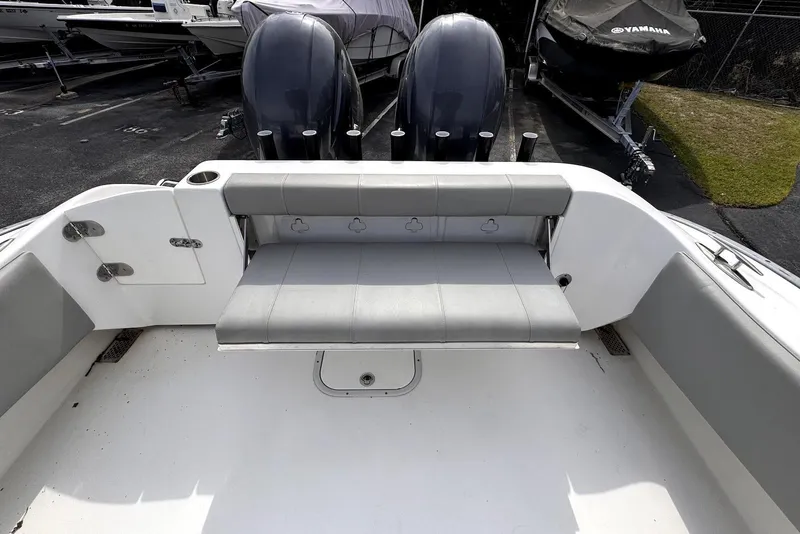 Slide: The Image of 2020 Cape Horn 27 XS boat interior with seating and dual engines. - 47