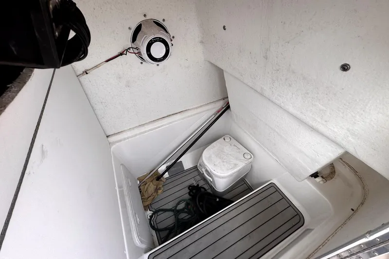 Slide: The Image of Interior of 2020 Cape Horn 27 XS boat with storage and portable toilet. - 50