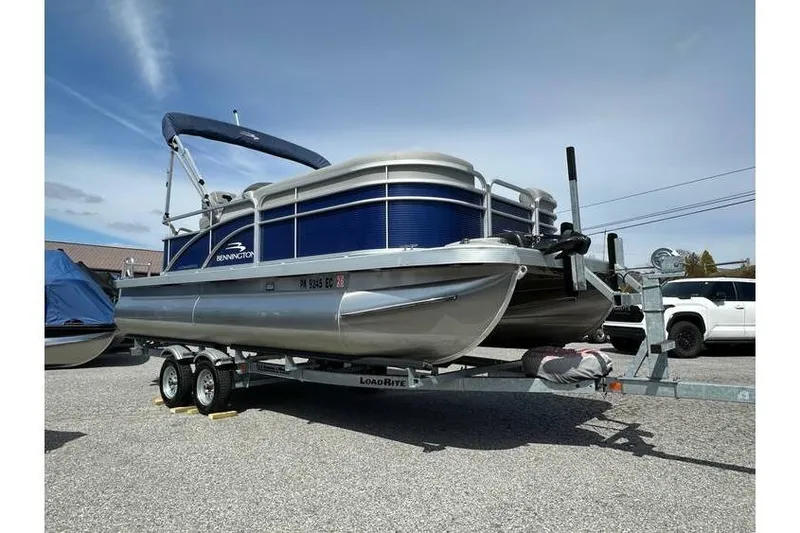 Slide: The Image of 2023 Bennington 20 SVL pontoon boat on tandem axle trailer with Yamaha 25Hp engine. - 10
