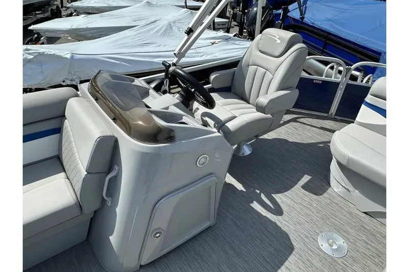 Slide: The Image of 2023 Bennington 20 SVL boat interior with steering console and seating. - 15