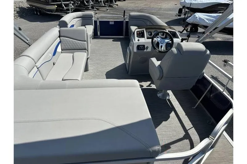 Slide: The Image of 2023 Bennington 20 SVL pontoon boat interior with Yamaha 25Hp engine and tandem axle trailer. - 22