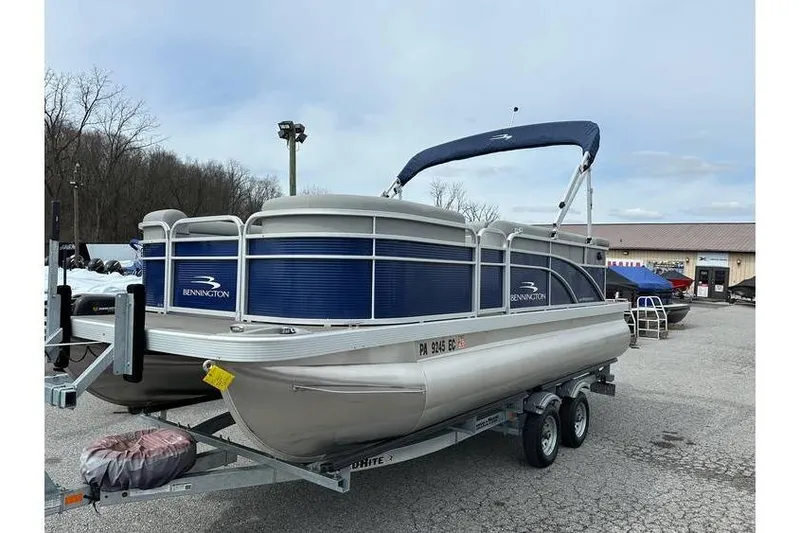 Slide: The Image of 2023 Bennington 20 SVL pontoon boat with Yamaha 25Hp on tandem axle trailer. - 5