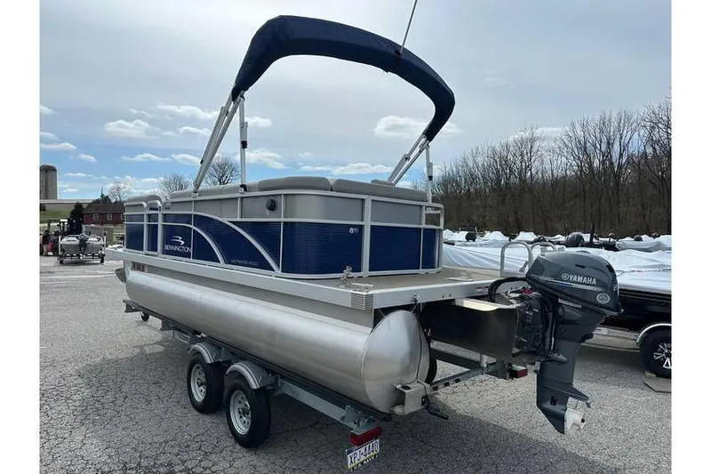 Slide: The Image of 2023 Bennington 20 SVL pontoon boat with Yamaha 25Hp engine on tandem axle trailer. - 7