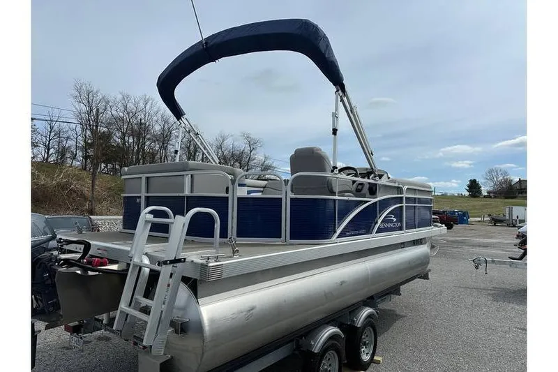 Slide: The Image of 2023 Bennington 20 SVL pontoon boat with Yamaha 25Hp engine and tandem axle trailer. - 9