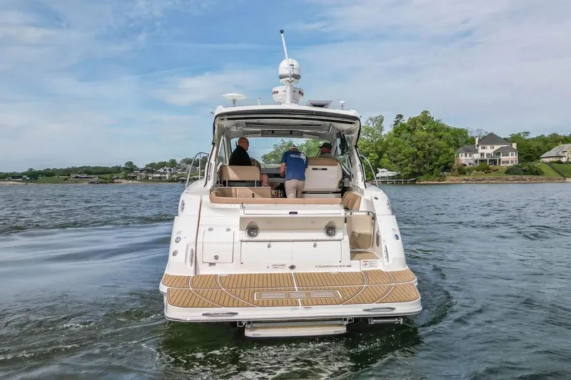 Slide: The Image of 2017 Sea Ray Sundancer 350 Coupe cruising on a scenic lake. - 13