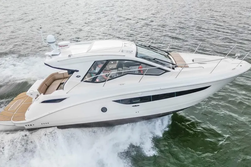 Slide: The Image of 2017 Sea Ray Sundancer 350 Coupe cruising on open water. - 15
