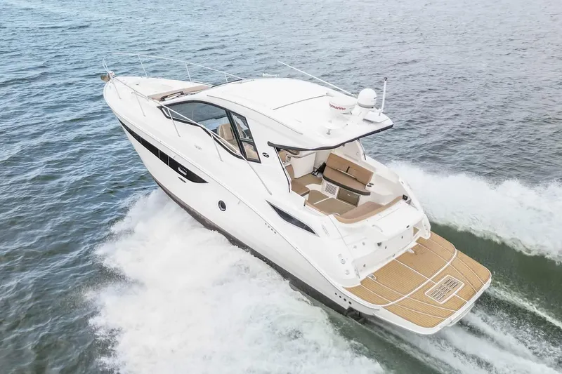 Slide: The Image of 2017 Sea Ray Sundancer 350 Coupe cruising on open water. - 17