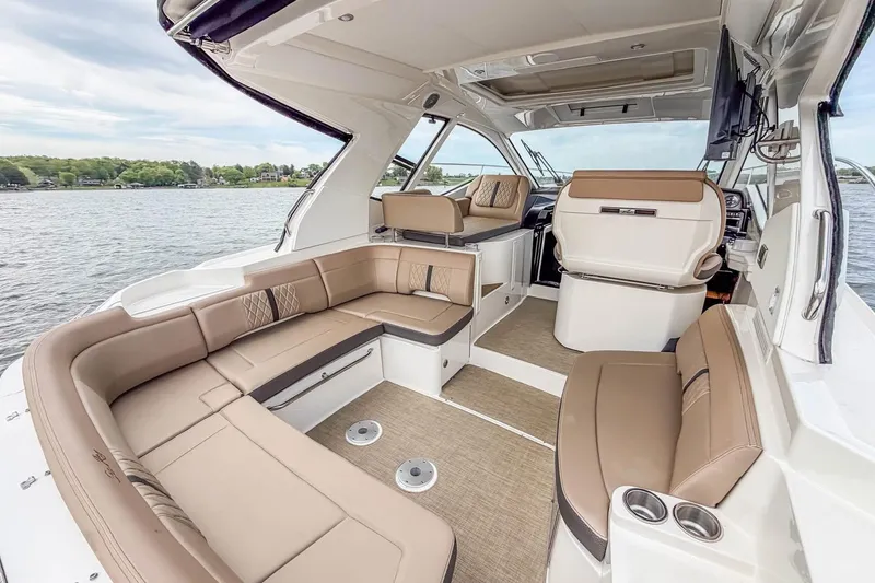 Slide: The Image of 2017 Sea Ray Sundancer 350 Coupe interior with luxurious seating and scenic water view. - 20