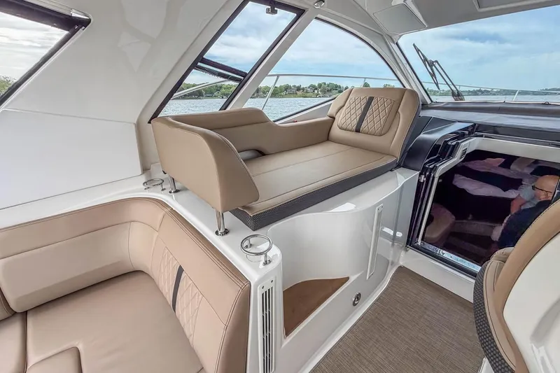Slide: The Image of Interior of 2017 Sea Ray Sundancer 350 Coupe with luxurious seating and scenic view. - 24