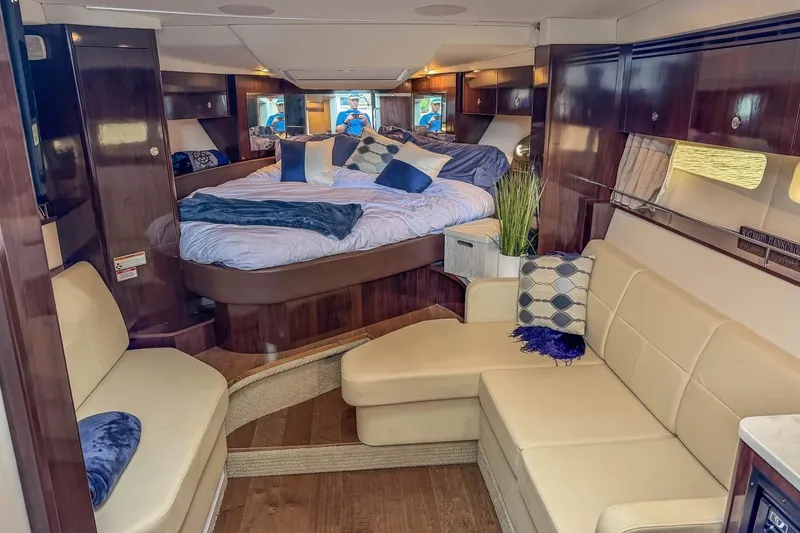 Slide: The Image of Luxurious interior of 2017 Sea Ray Sundancer 350 Coupe with cozy seating and elegant bedding. - 27