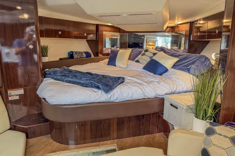 Slide: The Image of Luxurious interior of 2017 Sea Ray Sundancer 350 Coupe with cozy bed and elegant decor. - 31