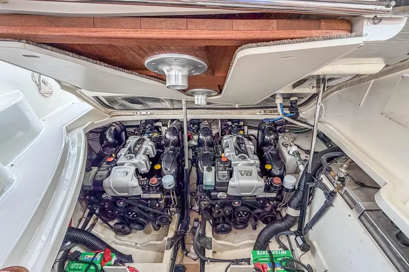 Slide: The Image of Engine compartment of a 2017 Sea Ray Sundancer 350 Coupe, showcasing dual V8 engines. - 36