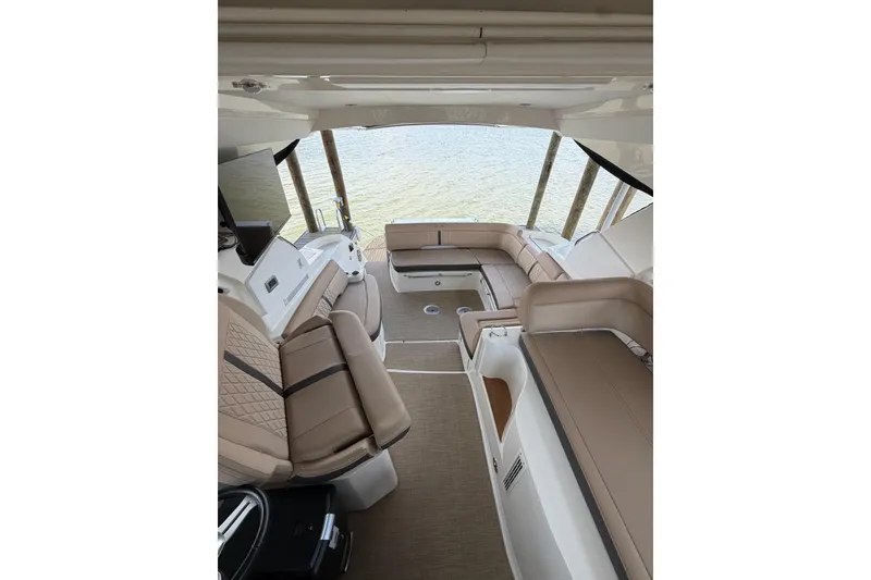 Slide: The Image of Interior of 2017 Sea Ray Sundancer 350 Coupe with luxurious seating and water view. - 4