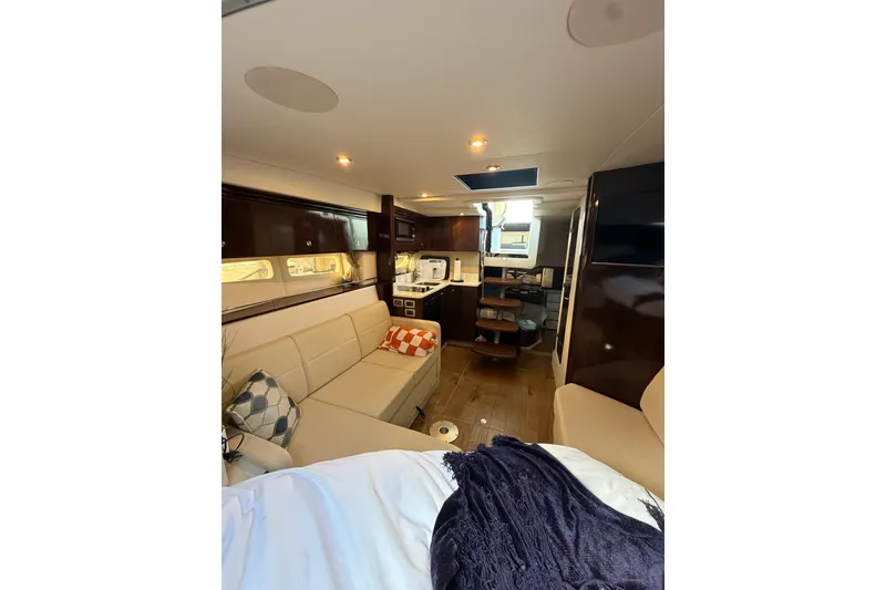 Slide: The Image of Interior of 2017 Sea Ray Sundancer 350 Coupe with modern seating and kitchenette. - 7