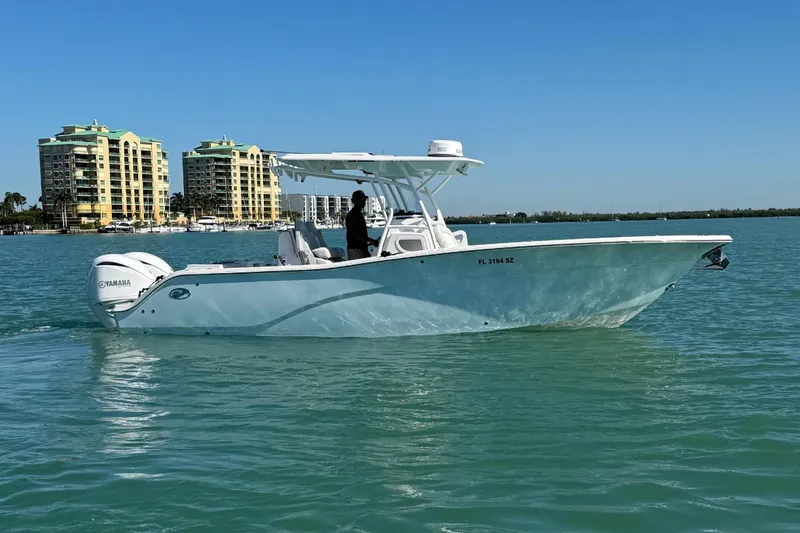 Slide: The Image of 2021 Sea Fox 288 Commander on calm water near high-rise buildings. - 11