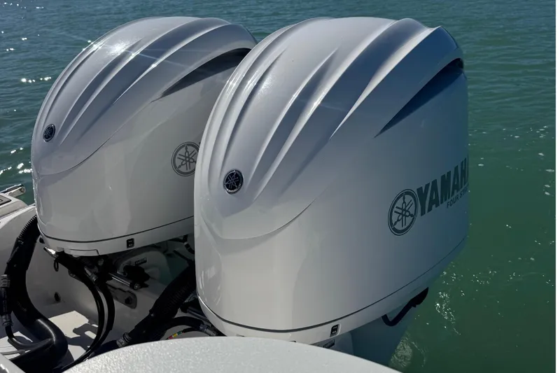 Slide: The Image of Twin Yamaha outboard engines on a 2021 Sea Fox 288 Commander boat in sunny waters. - 13