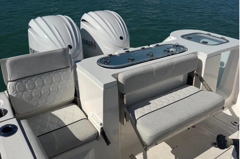 Slide: The Image of 2021 Sea Fox 288 Commander boat interior with seating and dual Yamaha engines. - 15
