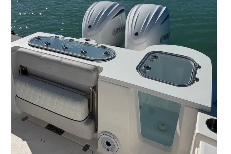 Slide: The Image of 2021 Sea Fox 288 Commander boat with dual Yamaha engines on calm water. - 16