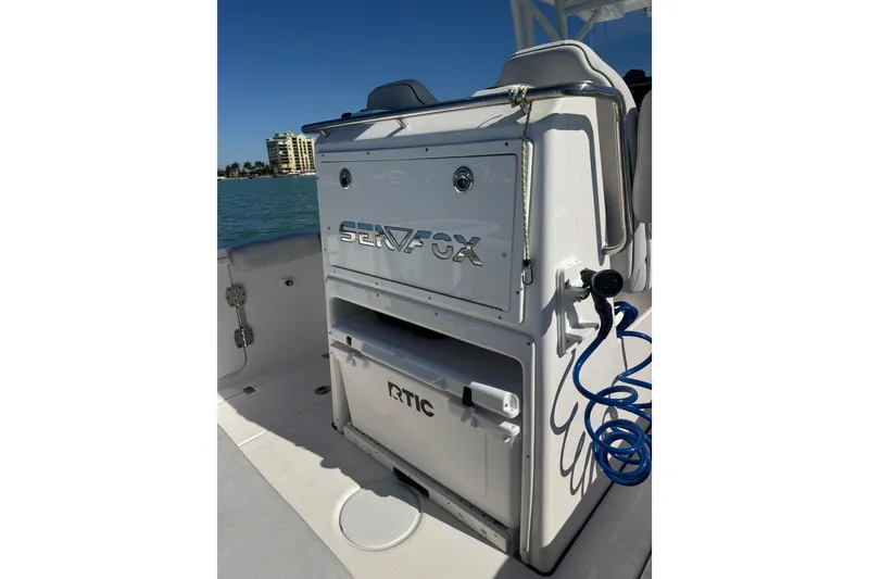 Slide: The Image of 2021 Sea Fox 288 Commander boat with RTIC cooler and blue coiled hose. - 17