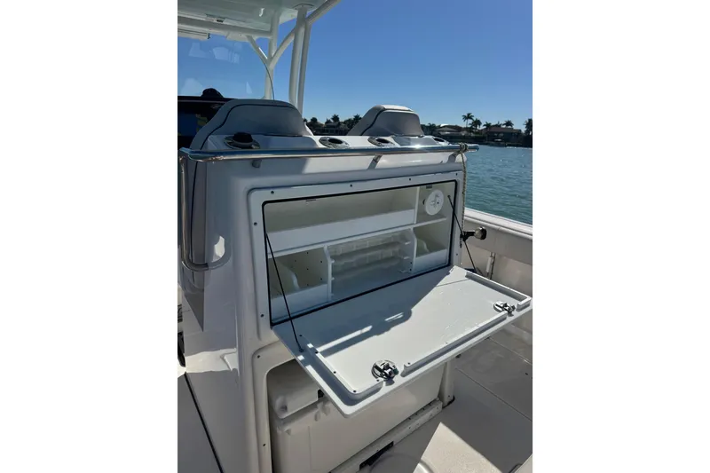 Slide: The Image of 2021 Sea Fox 288 Commander boat with open storage compartment on deck. - 18