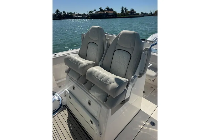 Slide: The Image of Luxury seating on 2021 Sea Fox 288 Commander boat, overlooking serene water. - 19