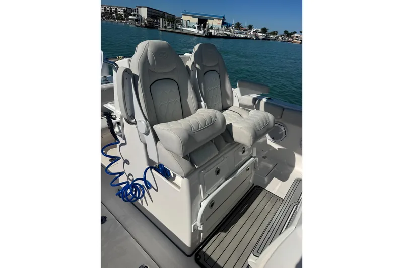 Slide: The Image of 2021 Sea Fox 288 Commander boat seats with ocean view in the background. - 20