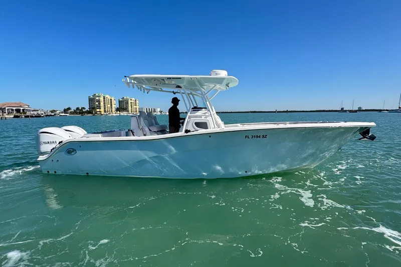 Slide: The Image of 2021 Sea Fox 288 Commander boat cruising on clear blue water under a sunny sky. - 28