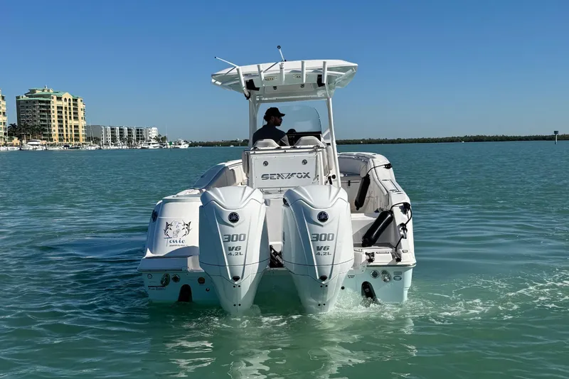 Slide: The Image of 2021 Sea Fox 288 Commander boat cruising on clear blue water. - 31