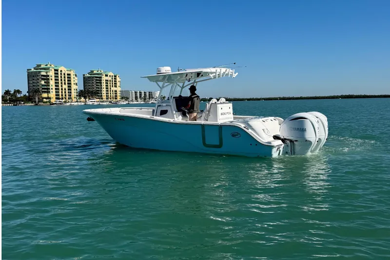 Slide: The Image of 2021 Sea Fox 288 Commander on calm waters near high-rise buildings. - 4