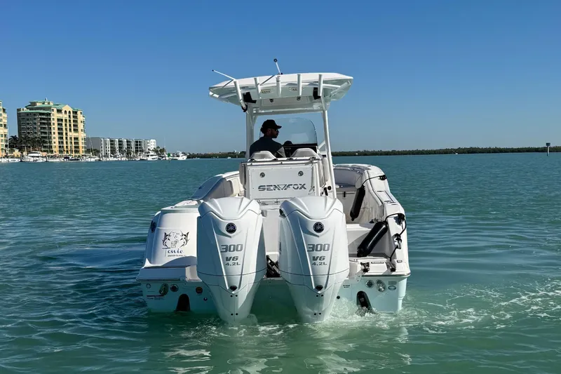 Slide: The Image of 2021 Sea Fox 288 Commander on calm water with dual outboard engines. - 7