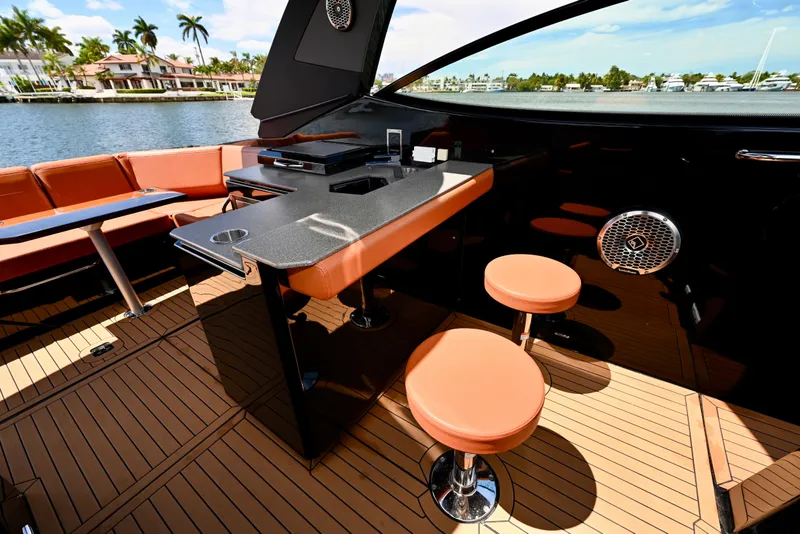 Slide: The Image of Luxurious interior of 2022 Cruisers Yachts 38 GLS OB with elegant seating and waterfront view. - 14