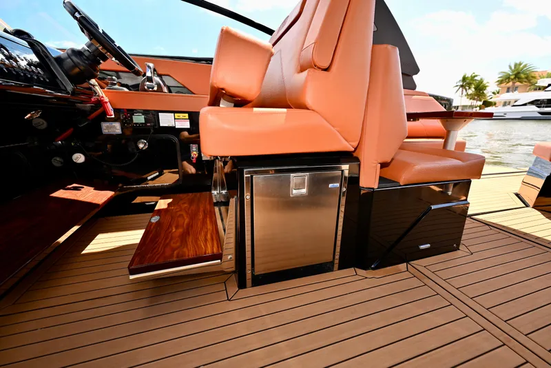 Slide: The Image of 2022 Cruisers Yachts 38 GLS OB interior with tan seating and sleek flooring. - 16