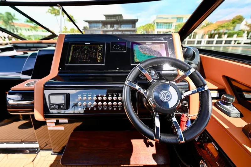 Slide: The Image of 2022 Cruisers Yachts 38 GLS OB helm with advanced navigation displays and controls. - 17