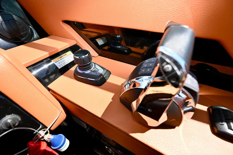 Slide: The Image of 2022 Cruisers Yachts 38 GLS OB helm controls with joystick and throttle. - 19