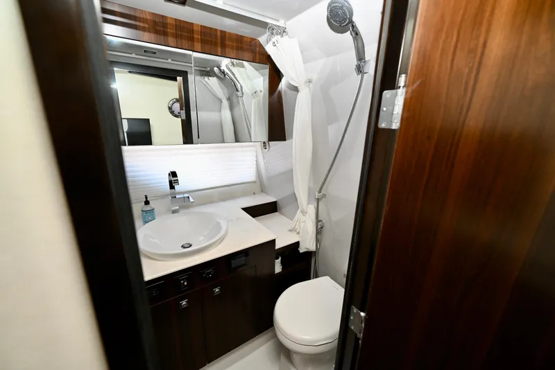 Slide: The Image of Luxurious bathroom in 2022 Cruisers Yachts 38 GLS OB with modern fixtures. - 33