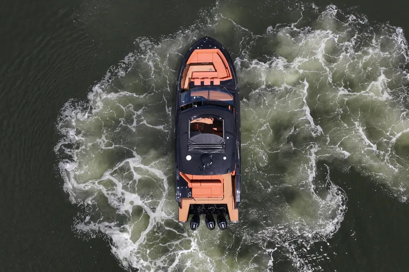 Slide: The Image of Aerial view of 2022 Cruisers Yachts 38 GLS OB navigating through water. - 38