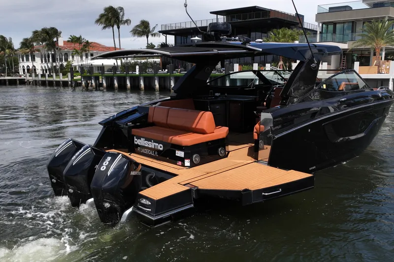 Slide: The Image of 2022 Cruisers Yachts 38 GLS OB with triple outboard engines on a scenic waterway. - 5