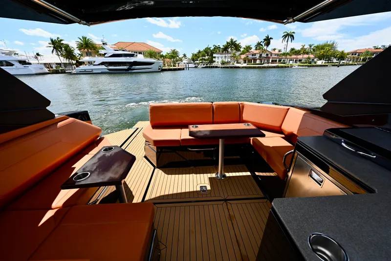 Slide: The Image of 2022 Cruisers Yachts 38 GLS OB interior with luxurious seating and waterfront view. - 9