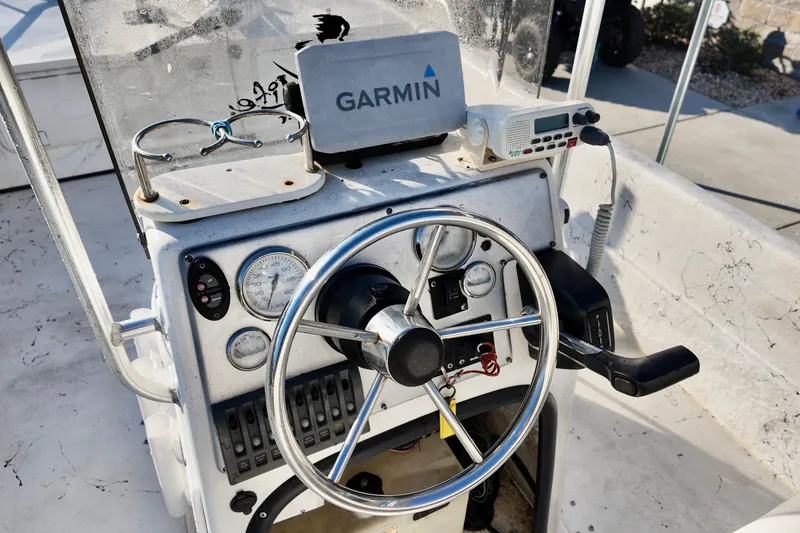 Slide: The Image of 2009 Carolina Skiff 18 DLX boat console with Garmin GPS and steering wheel. - 4