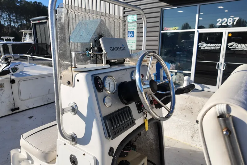 Slide: The Image of 2009 Carolina Skiff 18 DLX boat console with Garmin GPS, parked outside dealership. - 5