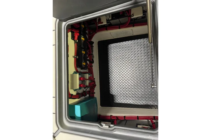 Slide: The Image of Electrical compartment of 2026 Sunsation 34 CCX boat with wiring and components. - 11
