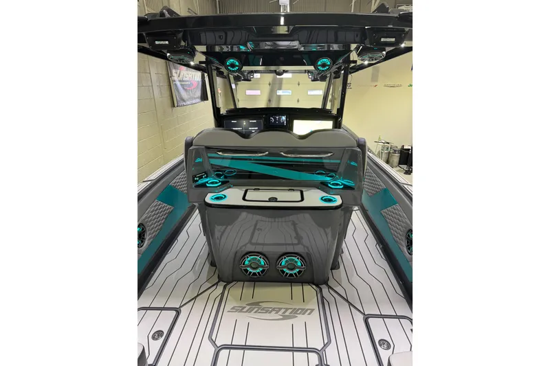 Slide: The Image of 2026 Sunsation 34 CCX boat interior with modern design and teal accents. - 12
