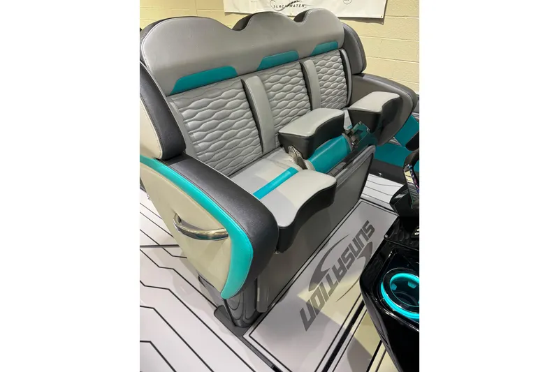 Slide: The Image of 2026 Sunsation 34 CCX boat interior with stylish gray and teal seating. - 16