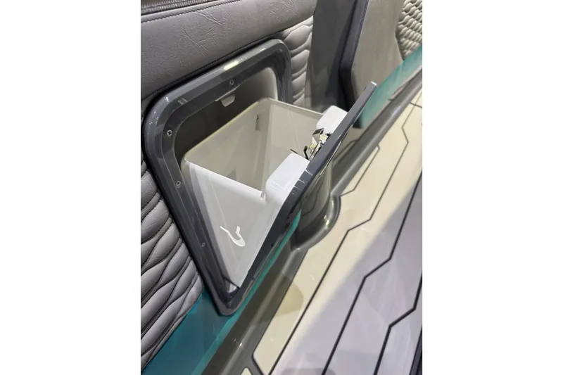 Slide: The Image of Built-in storage compartment on 2026 Sunsation 34 CCX boat interior. - 22