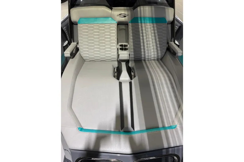 Slide: The Image of 2026 Sunsation 34 CCX boat interior with modern seating and teal accents. - 29