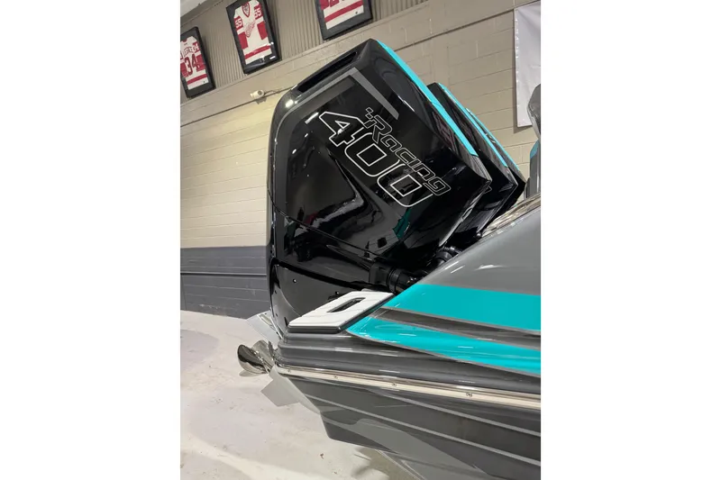 Slide: The Image of 2026 Sunsation 34 CCX boat with powerful Racing 400 engine in a showroom. - 3