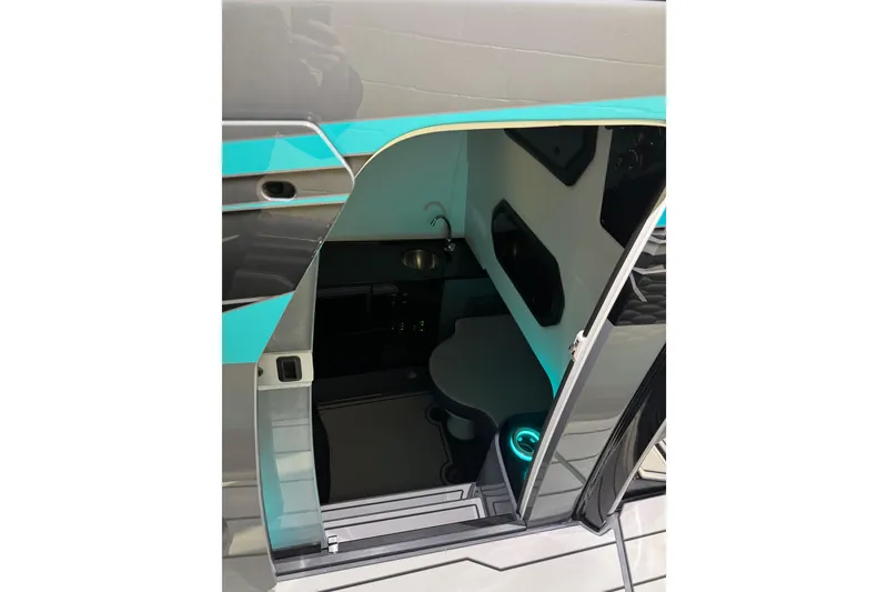 Slide: The Image of Interior view of 2026 Sunsation 34 CCX cabin with modern design and teal accents. - 34