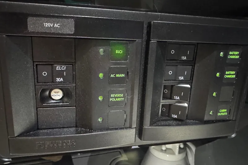 Slide: The Image of Electrical control panel on a 2026 Sunsation 34 CCX boat, featuring switches and indicators. - 39