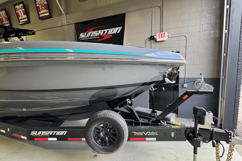 Slide: The Image of 2026 Sunsation 34 CCX powerboat on trailer in a garage setting. - 6